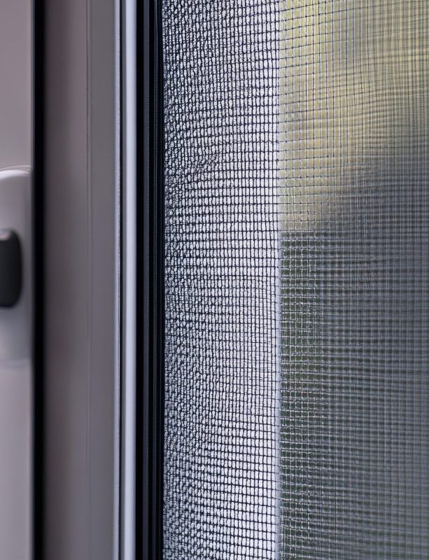 A close-up of a magnetic mosquito net door, showing its easy-to-use design