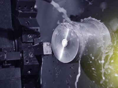 Spindle chuck and installed metal part in pocessing on high precision Cnc industrial lathe turning machine